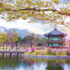 Golden Pagodas Amidst Mountains Reflecting on Tranquil Waters