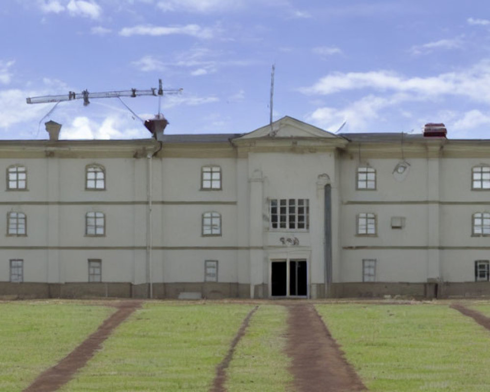 Symmetrical windows and antennas on weathered two-story building