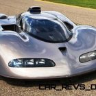 Silver High-Performance Hypercar with Slim Headlights Speeding