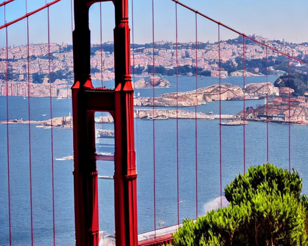 Red Suspension Bridge Tower with Cityscape and Bay View