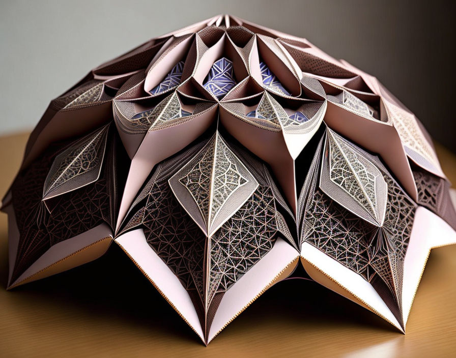 Geometric paper art sculpture with brown tones on wooden surface