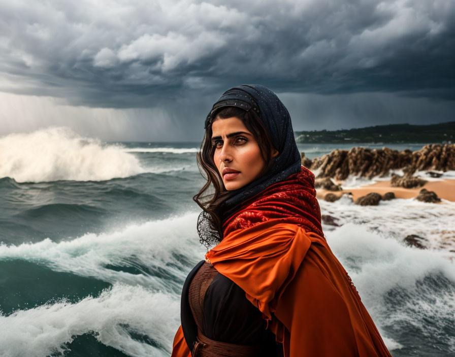 Pensive woman in red headscarf against stormy sea waves