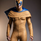 Superhero in Blue Mask and Cape on Gradient Background