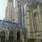 Medieval stone castle with towers, cobbled courtyard, flying birds, and a couple talking.