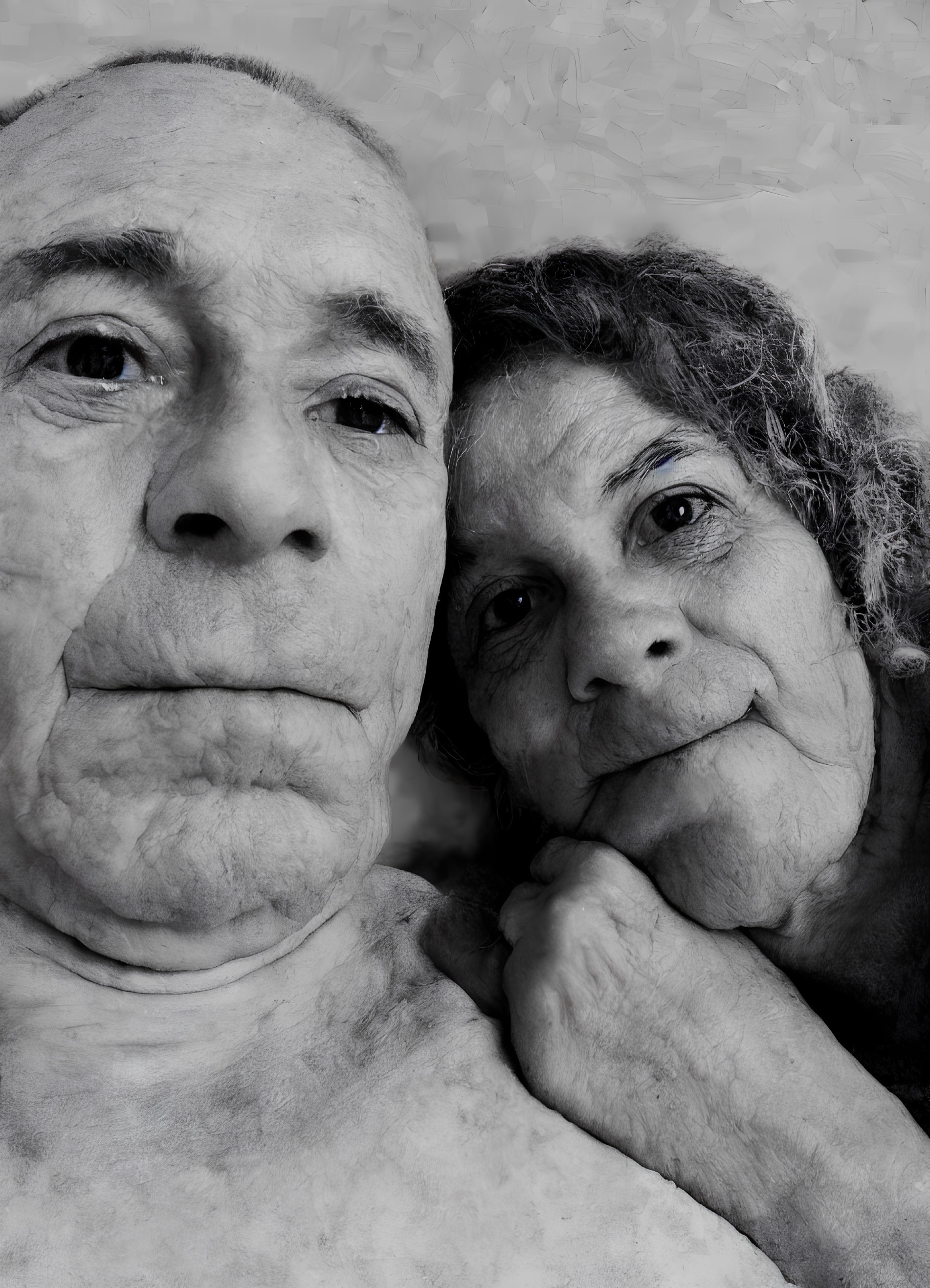 Monochrome portrait of elderly couple gazing at camera