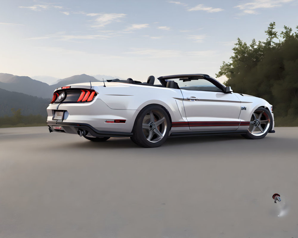 Convertible sports car parked with mountains in background.