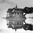 Whimsical isolated house on small island at twilight