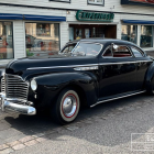 Vintage Car with Chrome Details in Stylized Landscape