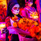 Colorful Day of the Dead Woman Figurine with Flower and Festive Lights