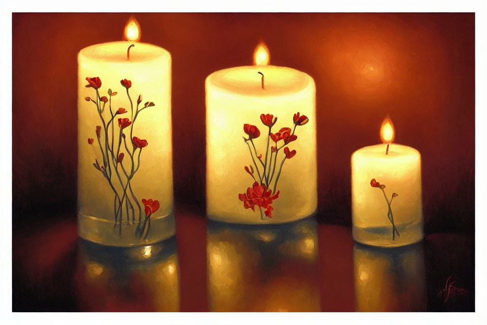 Three lit candles with red floral designs on glossy surface against warm-toned background