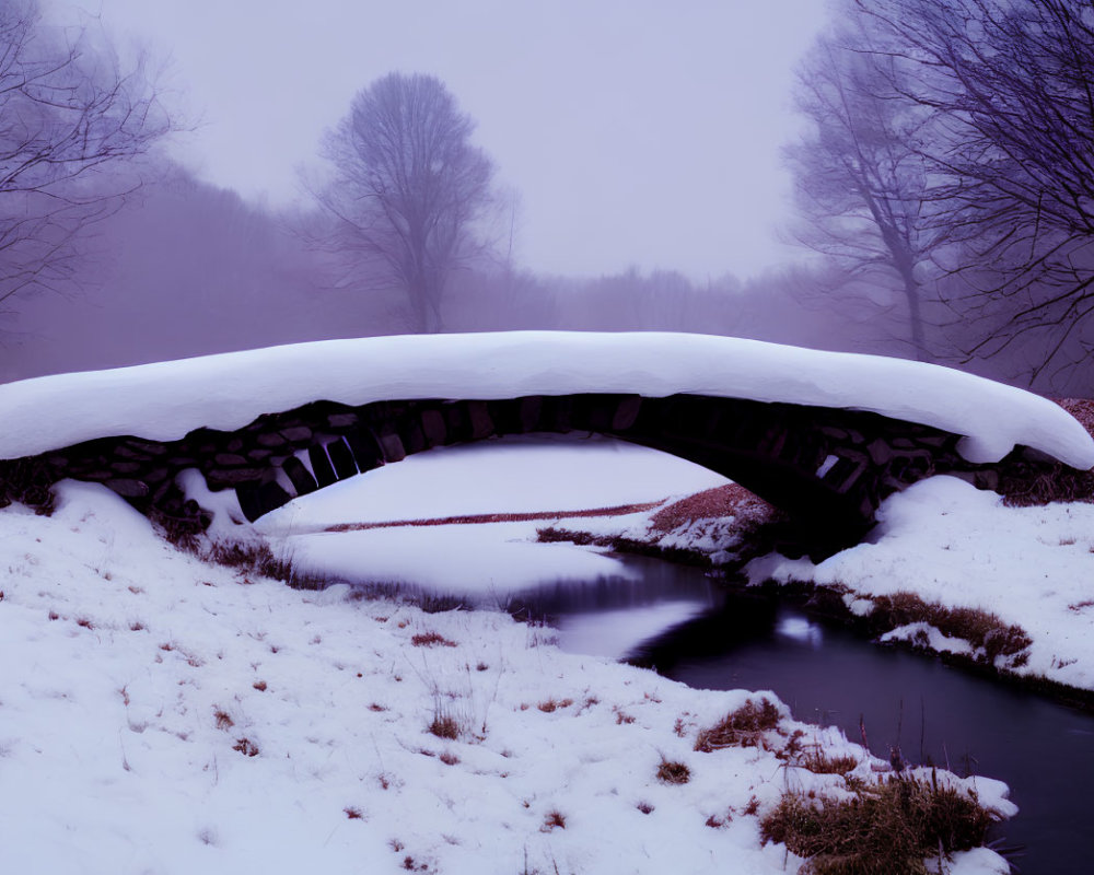 Snow-covered Stone Footbridge Over Tranquil Stream in Winter Landscape