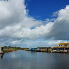 Tranquil Harbor Scene with Colorful Boats and Traditional Houses