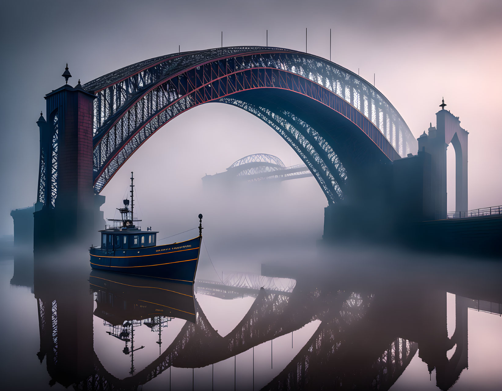 Boat on calm water near mist-covered arch bridge