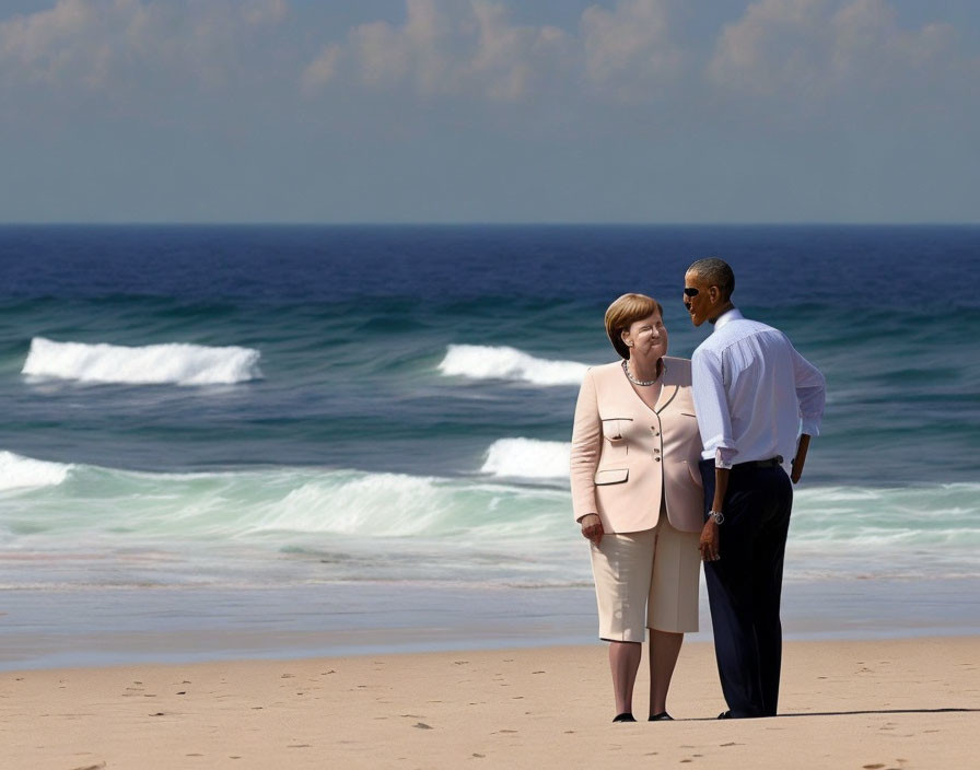 Two people talking on a sunny beach with waves.