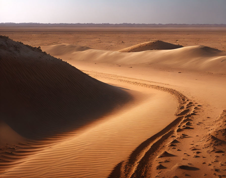 Rippled Sand Dunes Under Hazy Sky