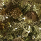 Decorated Christmas tree with gold and red baubles and silver tinsel