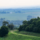 Misty Morning Landscape: Foggy Hills and Traditional Houses