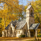 Vibrant, multicolored woodland scene with mosaic-like texture and stained-glass style house among