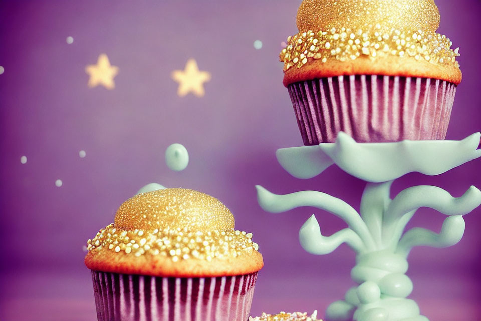 Golden-Glittered Cupcakes on Purple Background with Stars