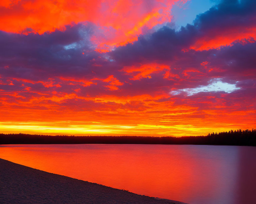 Fiery orange and red sunset reflected on calm lake