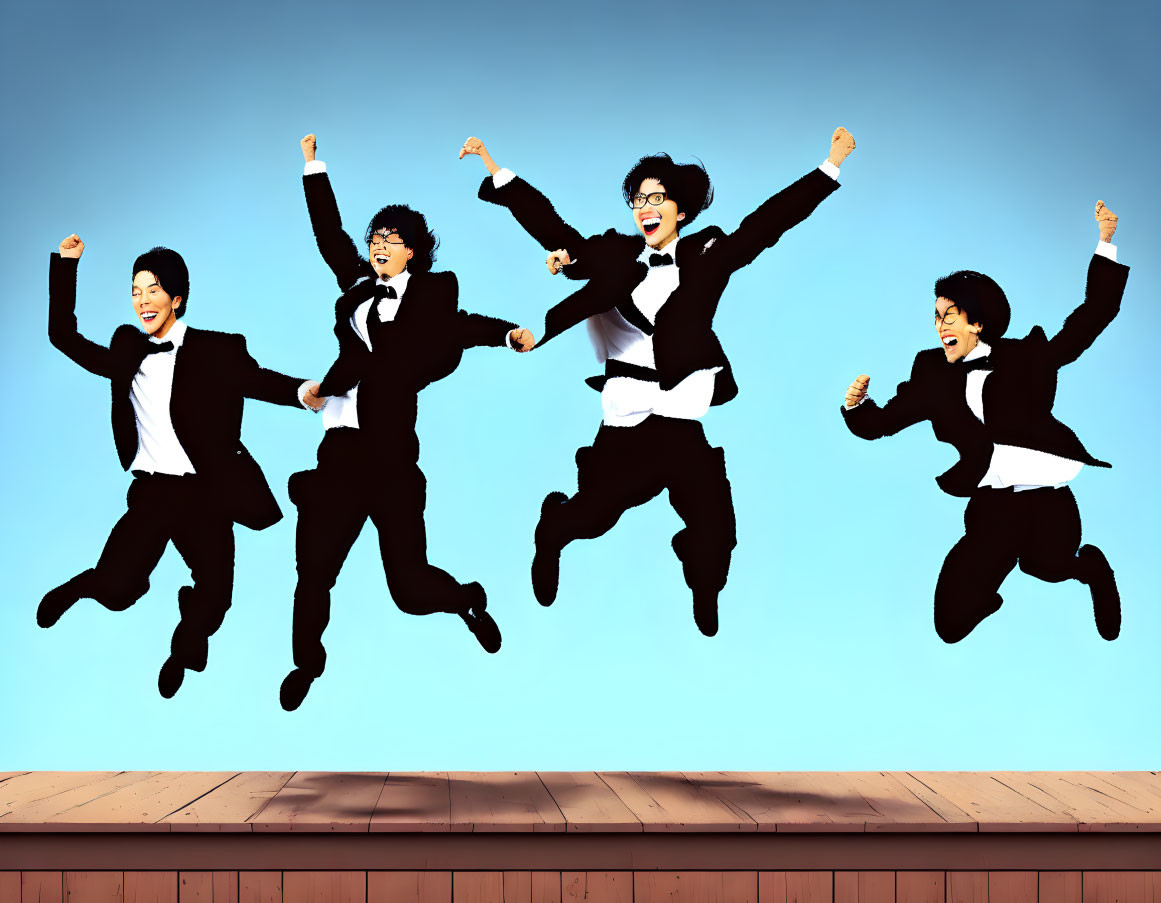 Four Business Attire Individuals Jumping Against Blue Sky