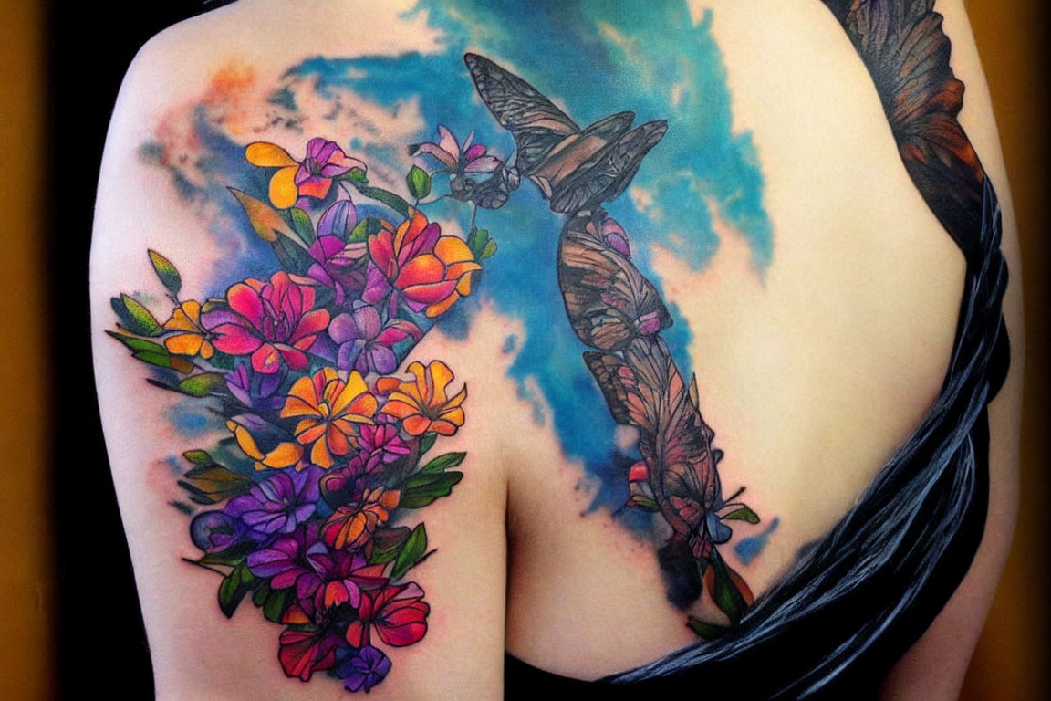 Colorful Back Tattoo of Flowers and Butterflies on Watercolor Background