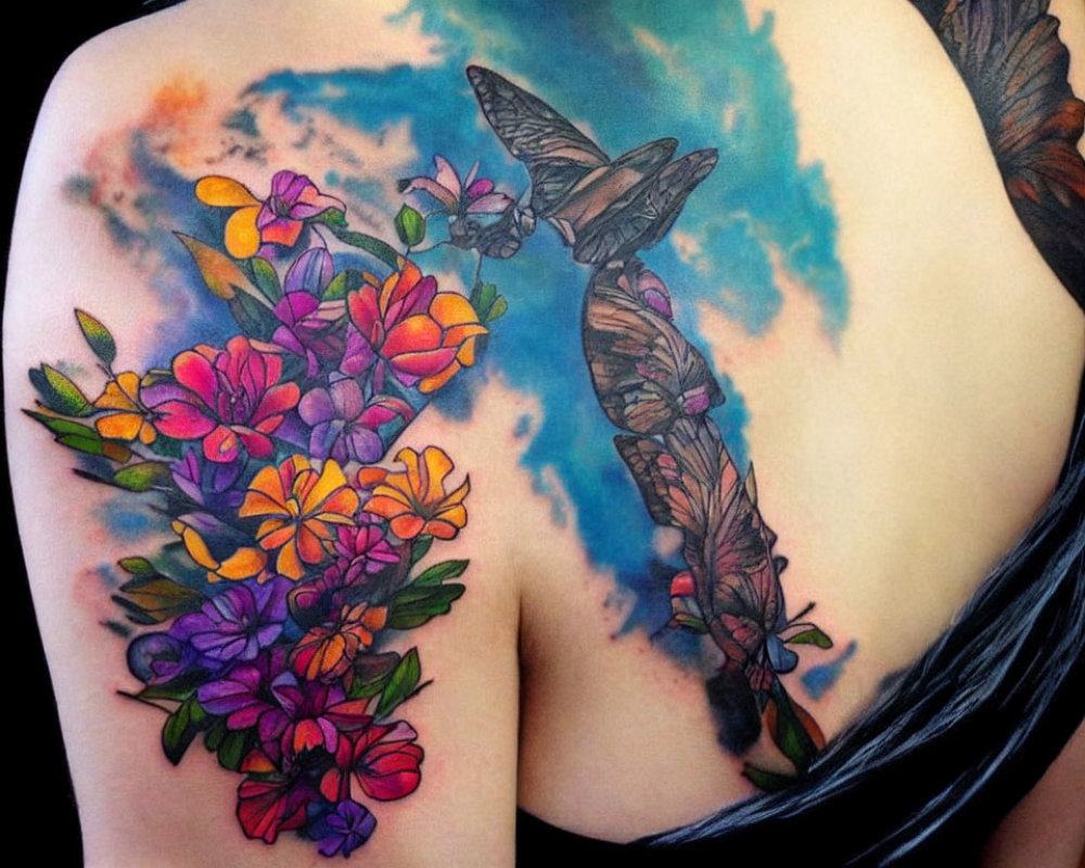 Colorful Back Tattoo of Flowers and Butterflies on Watercolor Background