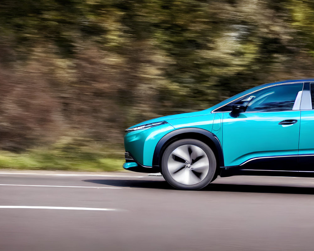 Teal Electric SUV Speeding on Asphalt Road