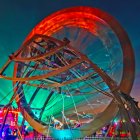 Acrobatic Show with Large Circular Structure and Dynamic Lighting