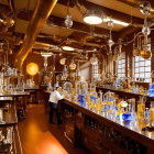 Glass vessels and glowing tubes in a steampunk laboratory setting