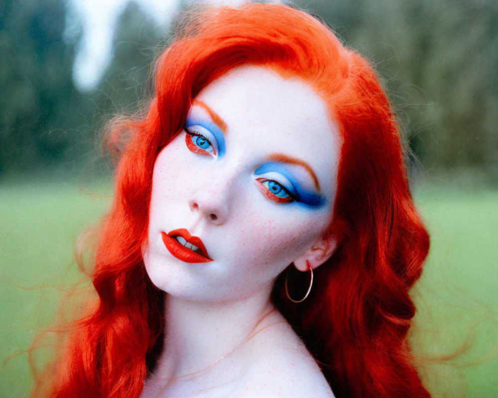 Portrait of a Woman with Red Hair, Porcelain Skin, Blue Eyeshadow, and Red Lip