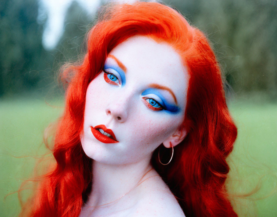 Portrait of a Woman with Red Hair, Porcelain Skin, Blue Eyeshadow, and Red Lip