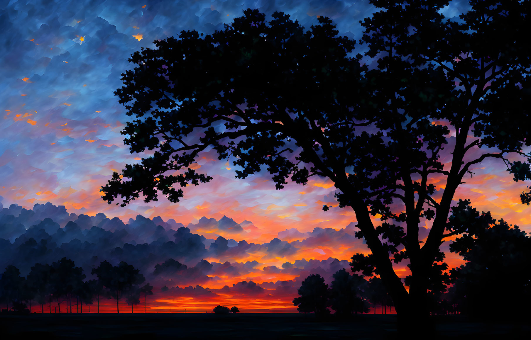 Vibrant orange and blue sunset silhouettes trees against cloudy sky