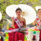 Three stylized women in a field of red poppies of varying heights