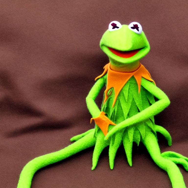 Bright Green Kermit the Frog Plush Toy on Brown Background