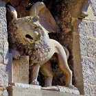 Intricate stone lion statue in arched alcove with ornate carvings