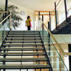 Staircase with gold patterns and celestial mural featuring stars, planets, and green plants