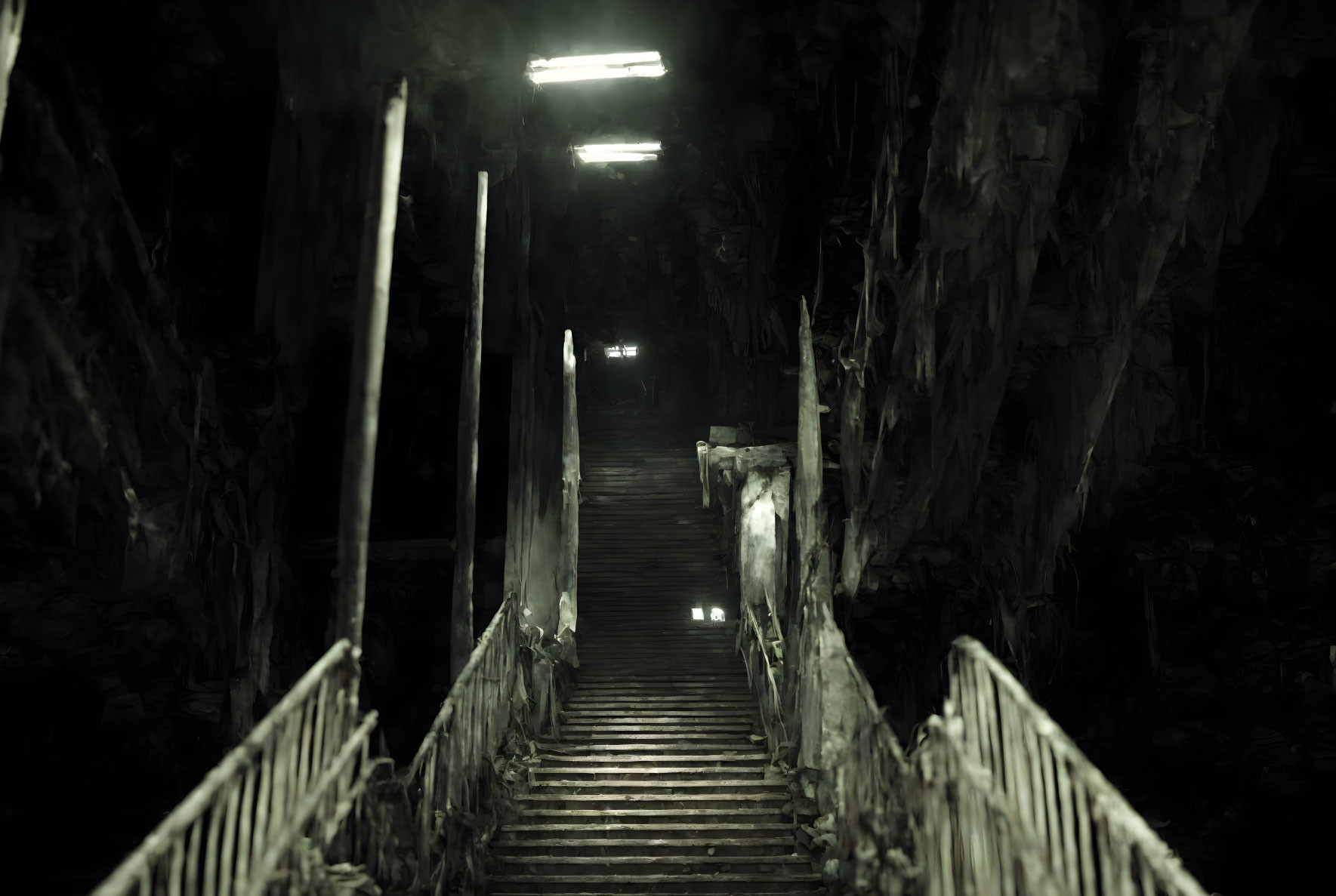 Eerie wooden staircase in dim light with overgrown foliage