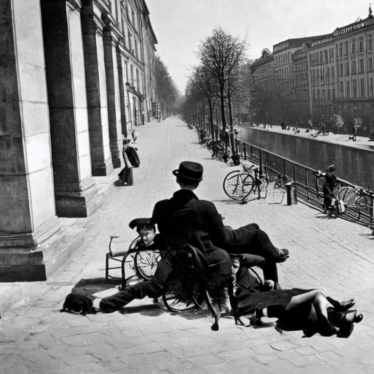 Vintage Black-and-White Photo: Three People by Canal with Bicycles