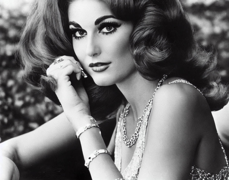 Classic Black and White Portrait of Woman with Voluminous Hair and Elegant Jewelry