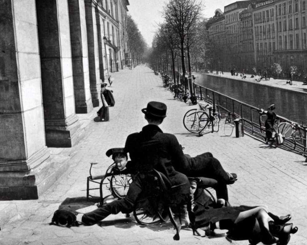 Vintage Black-and-White Photo: Three People by Canal with Bicycles