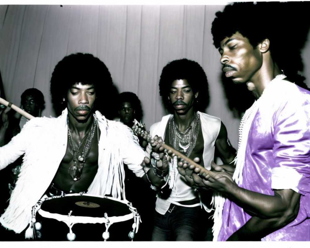 Intense men playing percussion at musical event