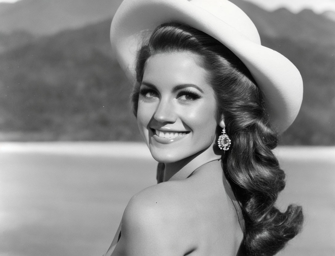 Vintage portrait of a woman with large hat and glamorous earrings