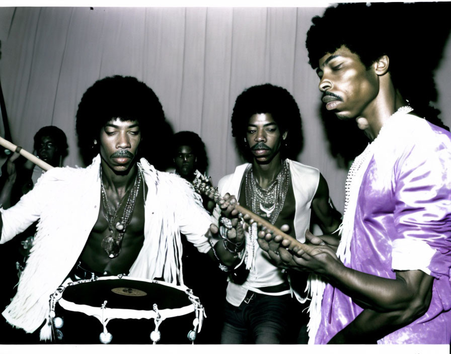 Intense men playing percussion at musical event