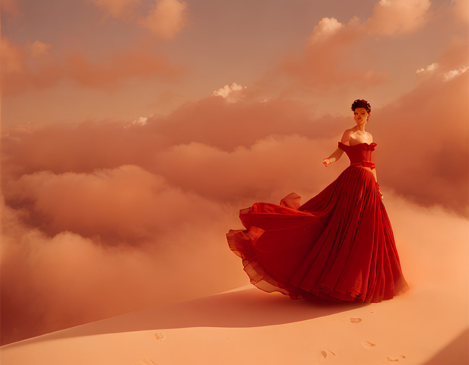 Woman in red gown on sand dune under dramatic sky