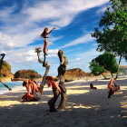 Three humanoid figures with staff on rocky terrain under clear sky