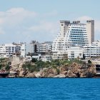 Vibrant Coastal Buildings and Marina Scene under Blue Sky