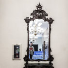 Bald person's reflection with hair drawn in ornate mirror frame