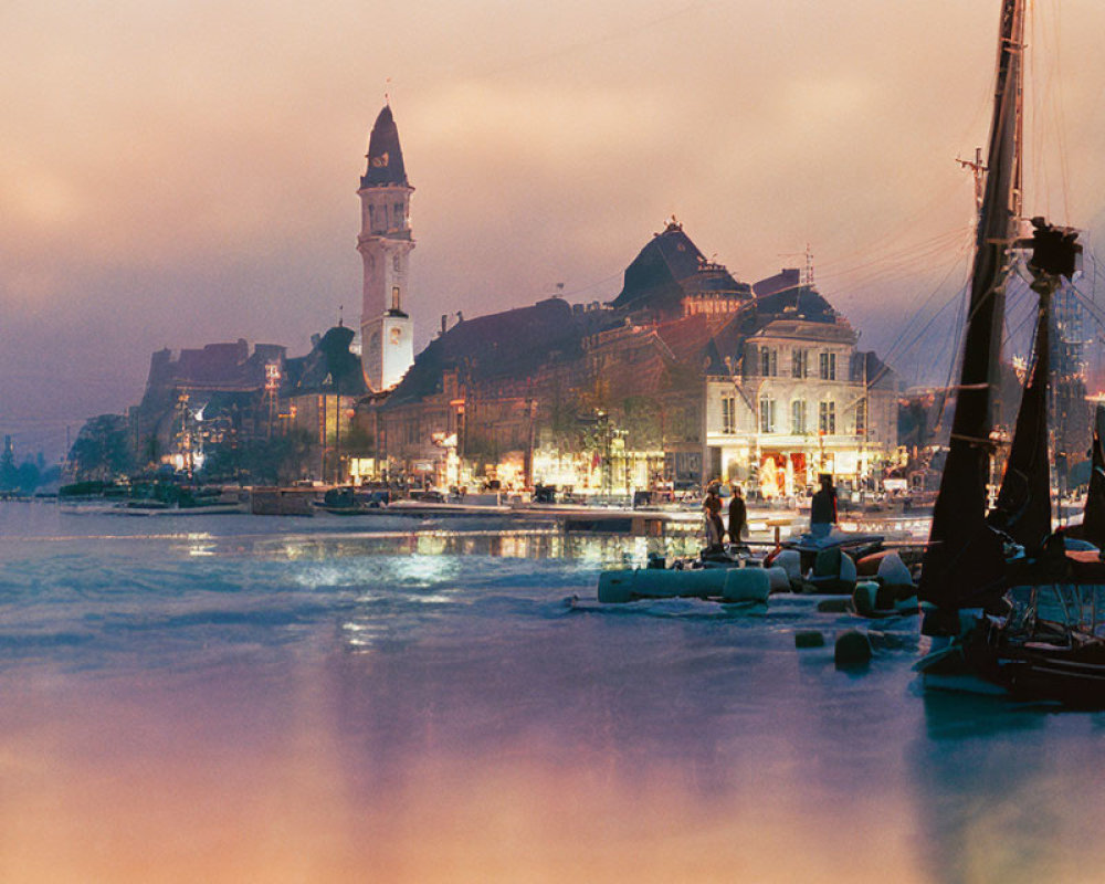 Cityscape with illuminated buildings, clock tower, and sailboat at twilight