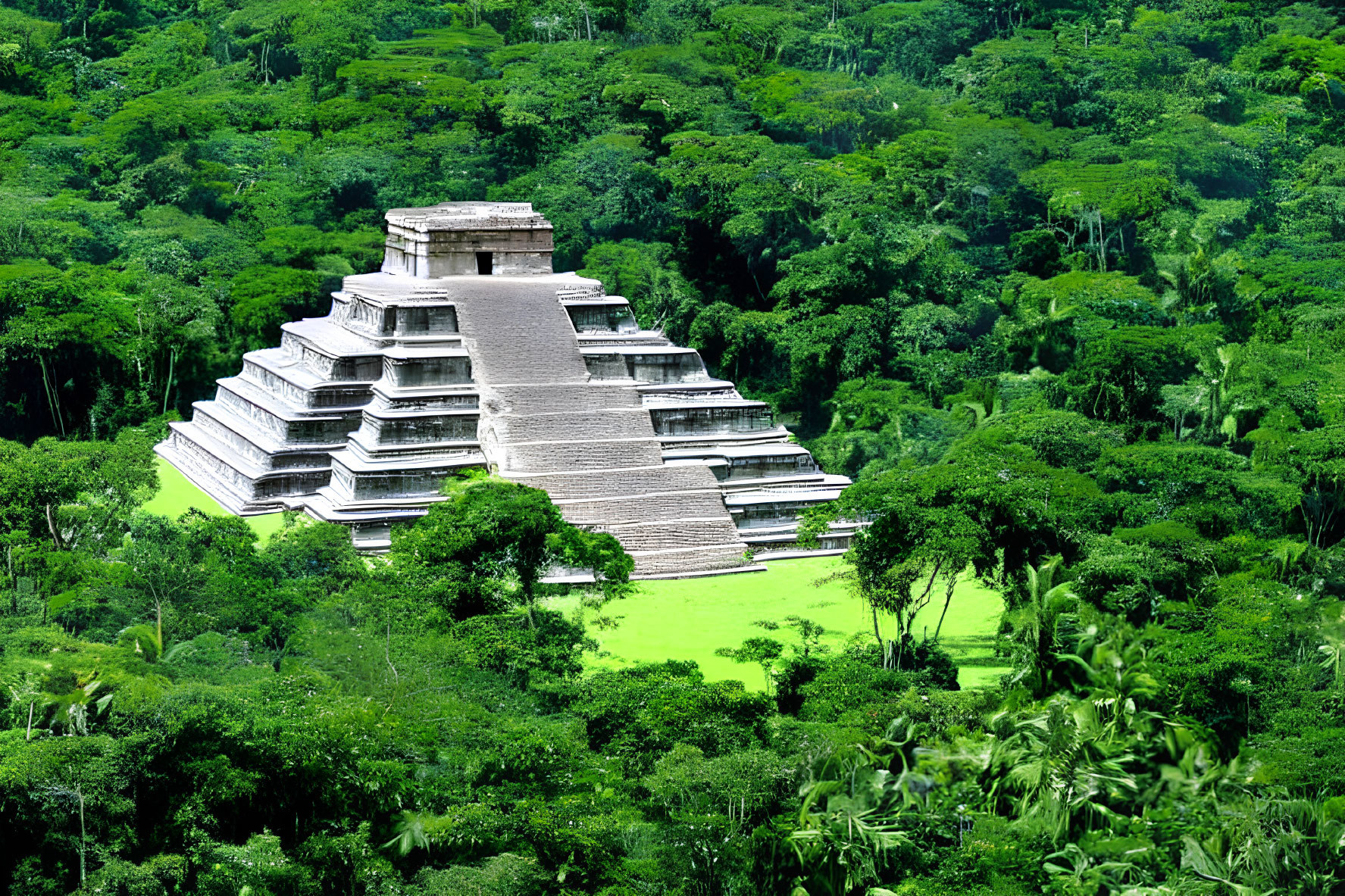 Ancient stepped pyramid in lush green jungle